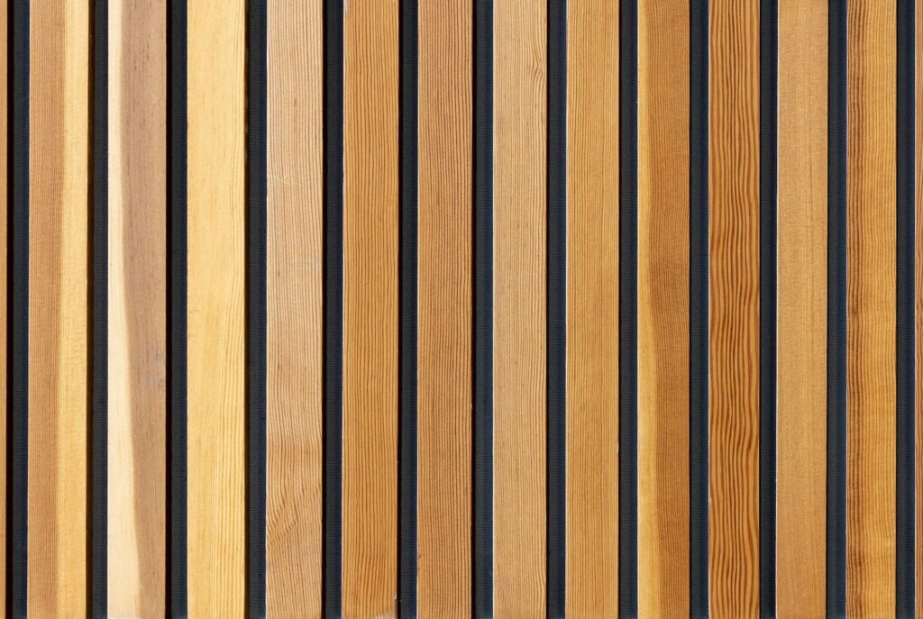 two brown wooden wall decors